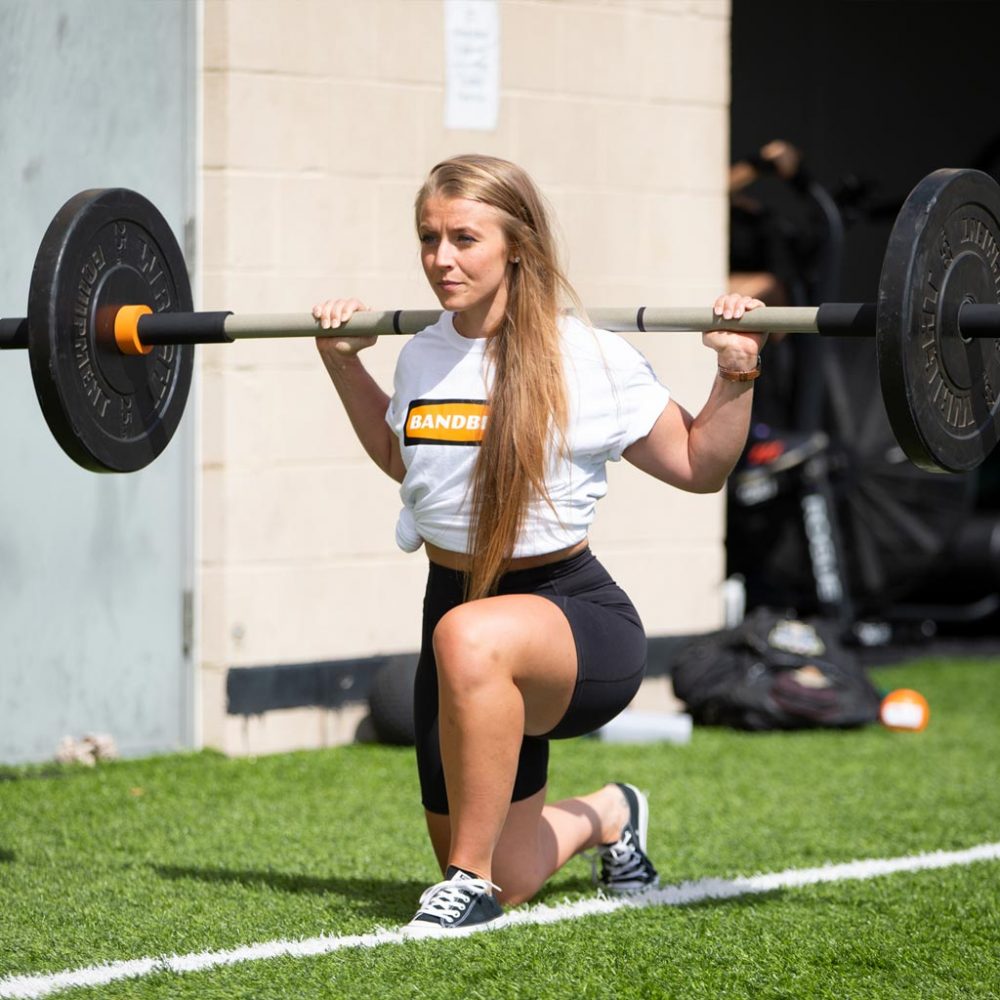 lady lunging with rhino flex bar outside