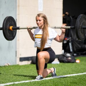 lady lunging with rhino flex bar outside